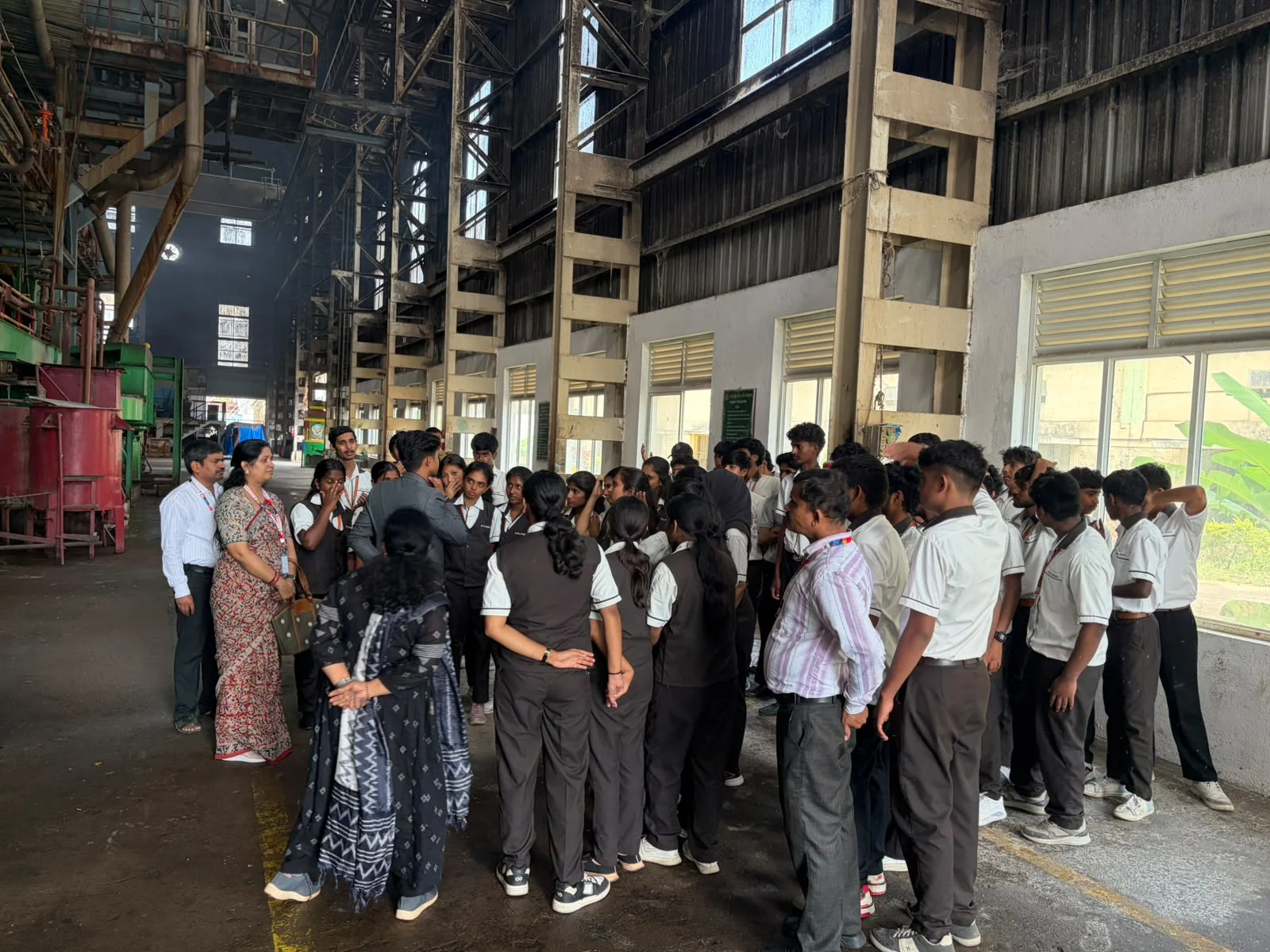 Student group outside an industrial facility